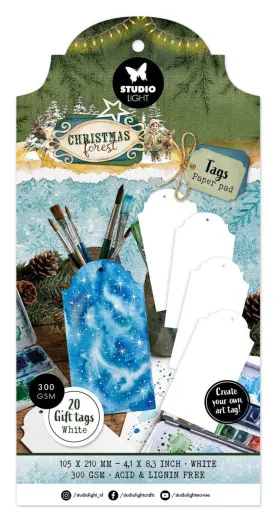 Weiße Anhänger-Block-Verpackung mit einem blau lackierten Beispiel-Tag zwischen Pinseln und Aquarellfarben