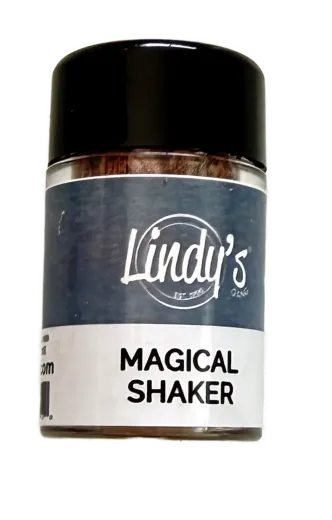 Fläschchen Magical Shaker von Lindy's Stamp Gang mit dunkelblauem Etikett und bräunlich schimmerndem Farbpulver.