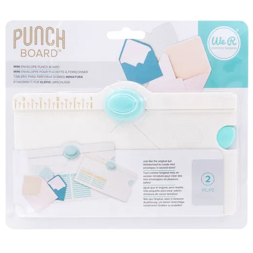 WRMK Mini Envelope Punch Board mit türkisen Stanzrollen und weißem Board, Produktverpackung und Anleitung im Hintergrund