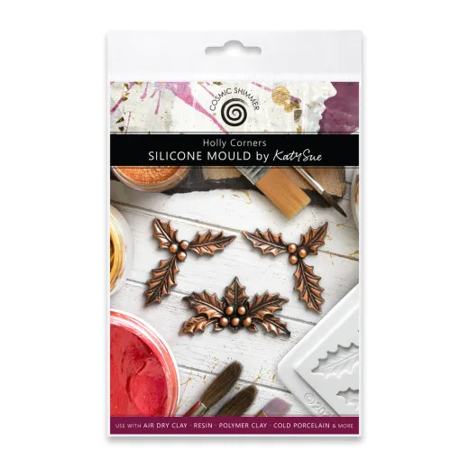 Verpackung der Silikonform „Holly Corners" mit drei kupferfarben gegossenen Stechpalmenblatt-Ecken mit Beeren