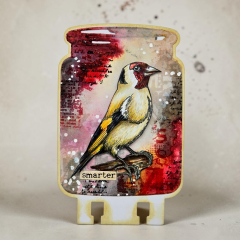 Gestaltete Karte im Glas-Design mit dem Vogel Clear Stamp in Rot- und Brauntönen
