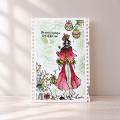 Weiße Karte mit Dame in Rot, Christbaumkugeln und Spruch The most wonderful time of the year