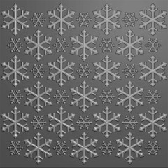 Prägefolder in Grau mit gleichmäßigem Muster aus großen und kleinen Schneeflocken in Nahaufnahme