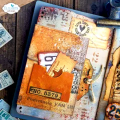 Anwendungsbeispiel: orangefarbene Vintage-Tasche mit Nummernschild „No. 5379“, Ticket-Stanzteil und Stempel-Schriftzug „Love this“.