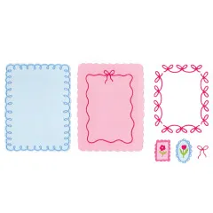 Fertig gestanzte Papierkreise und Rahmen in Blau und Rosa mit Blumenmotiven