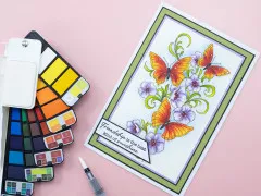 Mit der Palette kolorierte Grußkarte mit Schmetterlingen, Blüten und dem Spruch 'Friendship is the best kind of sunshine'.