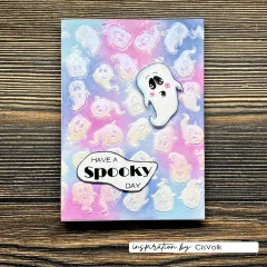 Pastellfarbene Karte mit Geister-Musterhintergrund und Schriftzug 'Have a Spooky Day'