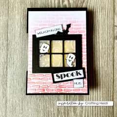 Schwarze Halloween-Fensterkarte mit rosa geprägtem Ziegelmuster-Hintergrund, zwei Geistern und niederländischem Text 'Welkom in ons Spookhuis'