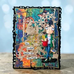 Bunte Karte mit gestempelter Heimwerkerin-Figur, Zahnrad-Zahlen-Stanzform und Wortstickern „this looked easier on YouTube"