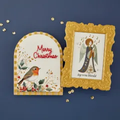 Anwendungsbeispiele: Goldgerahmte Anhängerkarte mit Rotkehlchen und gerahmtes Bild eines singenden Engels mit 'Joy to the World'.
