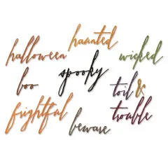 Nahaufnahme der ausgestanzten, farbigen Halloween-Wörter wie „spooky", „frightful" und „toil & trouble".