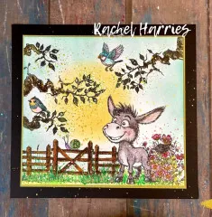 Ausgestaltete Grußkarte mit Clear Stamps: bunter Esel an Zaun mit Vögeln, Blumen und Aquarelleffekten