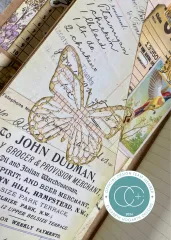 Journalseite mit gestanztem Schmetterling auf Händleranzeige und Vogel
