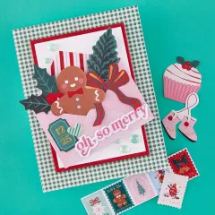 Weihnachtskarte mit Lebkuchenmann, Tannenzweig, roter Schleife und Schriftzug „oh, so merry“
