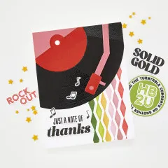 Karte mit schwarz-roter Schallplatte, rosa Tonarm, buntem Rautenmuster im Hintergrund und Grußtext 'JUST A NOTE OF thanks'.