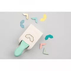 Stanzer neben verschiedenfarbigen Fotoecken aus Papier in Mint, Gold, Pink und Türkis