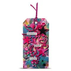 Bunter Anhänger mit pink-schwarzer Mond-und-Sterne-Stanzform und den Wortstickern „Confident", „Smart", „Loyal"