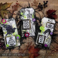 Drei gestaltete Anhänger Tags mit Halloween-Motiven und Knöpfen verziert