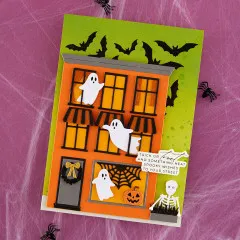 Halloween Karte in Orange und Grün mit gebrandetem Gebäude und Spuk-Details