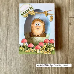 Pop-up-Karte mit Igel auf einer Schaukel an einem Ast, umgeben von Pilzen und Herbstlaub, Spruch „Feeling a bit Stuck".