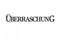 Schriftzug Überraschung als schwarzer Stempelabdruck auf weißem Grund