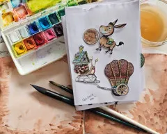 Handgefertigtes Heft mit platzierten Stanzteilen und Aquarellfarben