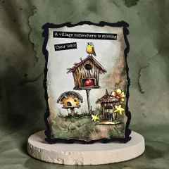 Karte mit drei Vogelhäusern, Rotkehlchen und Spruch A village somewhere is missing their idiot