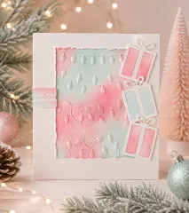 Pastellfarbene Weihnachtskarte mit geprägten Lichterketten und Geschenk-Stanzteilen
