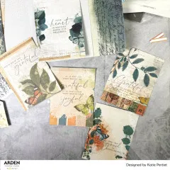 Ausgeschnittene Karten und Etiketten mit Vintage-Motiven und Sprüchen ausgelegt