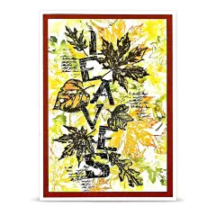 Künstlerische Bastelkarte mit herbstlichem Laub-Hintergrund, Schriftzügen und filigranen Blättern