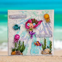 Scrapbooking-Projekt: Meerjungfrau mit pinken Haaren, blaue Augen, umgeben von Meerestieren, Strahlen-Muster türkis-gelb, Text-Boxen