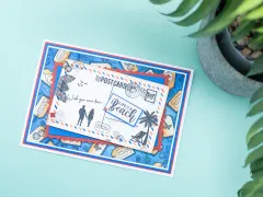 Gestempelte Postkarten-Karte mit Palme und Life's-a-Beach-Schriftzug, dekoriert mit rot-blauen Passepartouts
