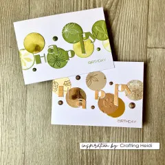 Zwei Geburtstagskarten „Happy Birthday" mit Konfetti-Kreisen in Grün-Gold- bzw. Beige-Goldtönen, gestaltet mit dem Happy-Schriftzug-Stanzset.
