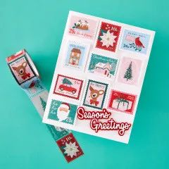 Weihnachtskarte mit aufgeklebten Washi-Tape-Briefmarken und Schriftzug „Season's Greetings“