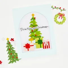 Handgemachte Weihnachtskarte dekoriert mit ausgestanzten Tannenbäumen und Geschenken