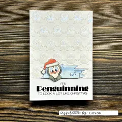 Weihnachtskarte mit glitzernd geprägten Pinguinen und Pinguin mit Weihnachtsmütze